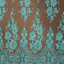 Dentelle de Calais turquoise sur fond marron