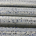Woven and iridescent fabric with blue tweed and sequins