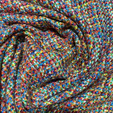 Woven and iridescent fabric with multicolored tweed effect