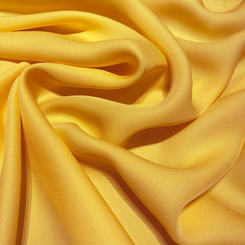 Yellow fluid silk crepe dobby fabric