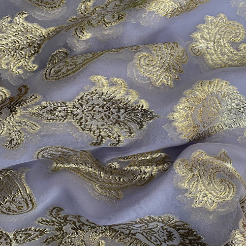 Gold metallic silk jacquard on a lilac chiffon background