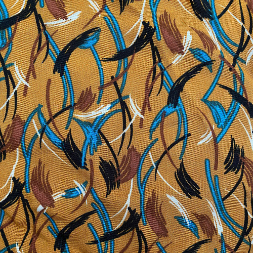 Twill fabric with feathers print on ochre background 100% viscose