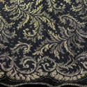 Calais lace gold laminette on a black background