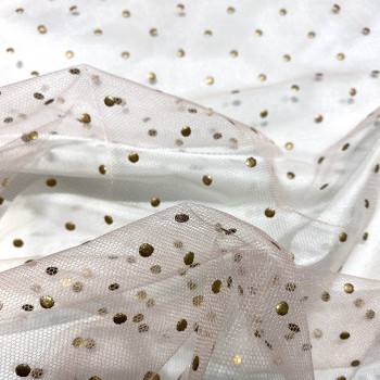 Sequined tulle with gold dots on a skin background