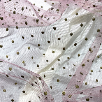 Sequined tulle with gold dots on pink background