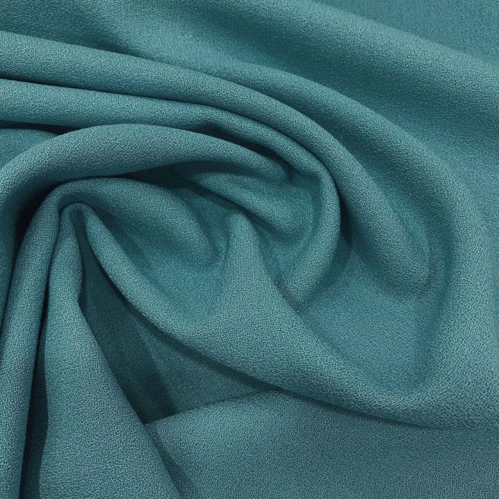 Tissu crêpe de laine 100% laine bleu lagon