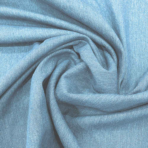 Stretch denim blue denim fabric with green trefoil edge