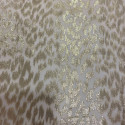 Gold metallic silk jacquard fabric on nude chiffon background Gold metallic silk jacquard fabric on nude chiffon background