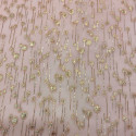 Metallic silk jacquard drops on a gold old pink muslin background Metallic silk jacquard drops on a gold old pink muslin background