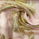 Metallic silk jacquard flowers on a gold old pink muslin background Metallic silk jacquard flowers on a gold old pink muslin background