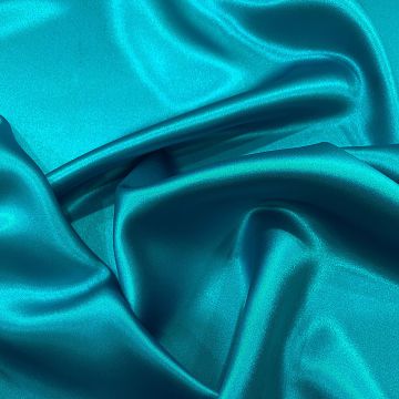 Turquoise blue satin-backed 100% silk crepe fabric