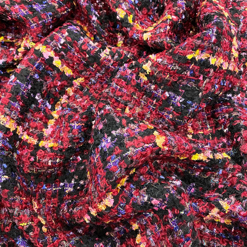 Woven and iridescent fabric with multicolored red tweed effect