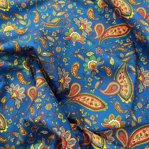 Tissu voile de coton imprimé paisley rouge et jaune sur fond bleu