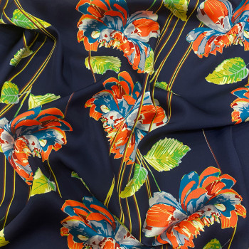 Polyester satin fabric with floral print on a midnight blue background