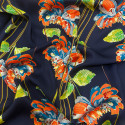 Polyester satin fabric with floral print on a midnight blue background