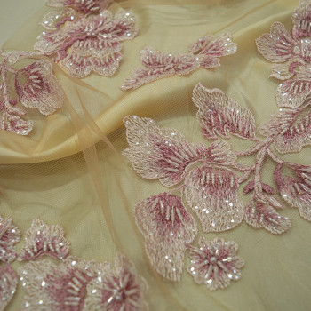 Pink beaded and embroidered tulle fabric