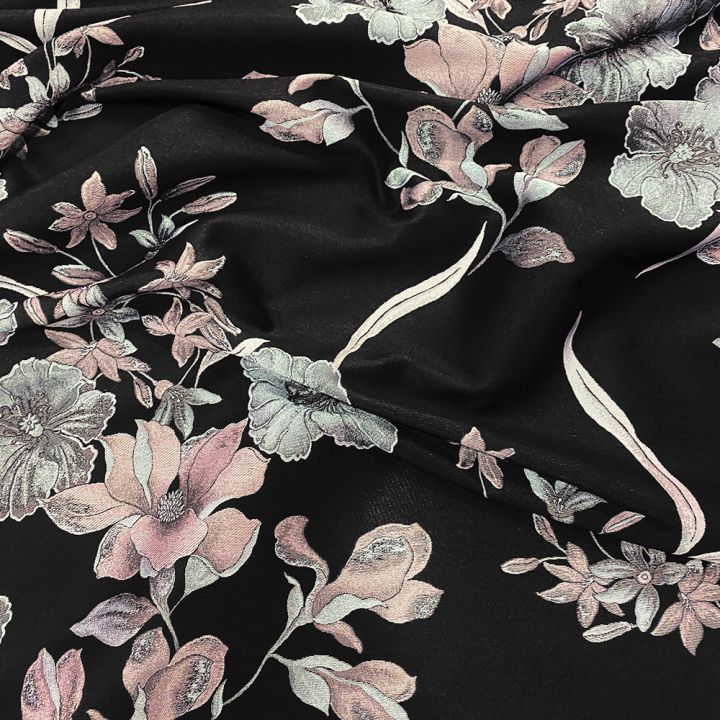 Jacquard fabric with two-tone floral pattern on black background