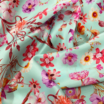 100% silk satin with floral all-over print on a sky blue background