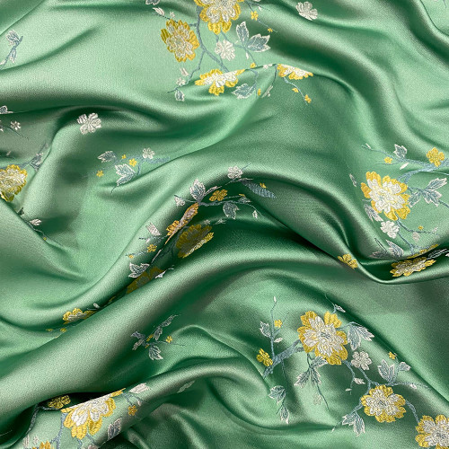 Satin jacquard fabric with jade green floral pattern