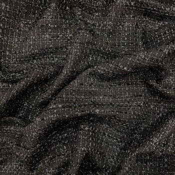 Black and thin gold threads woven and iridescent fabric