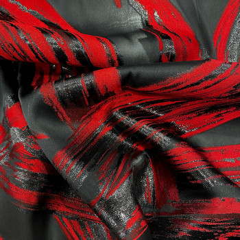 Red brush strokes on black background silk jacquard fabric