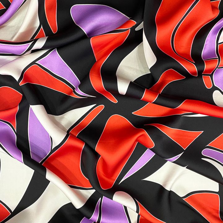 Tissu satin 100% soie imprimé vagues abstraites orange et violet