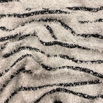 Woven and iridescent fabric with black and white stripes