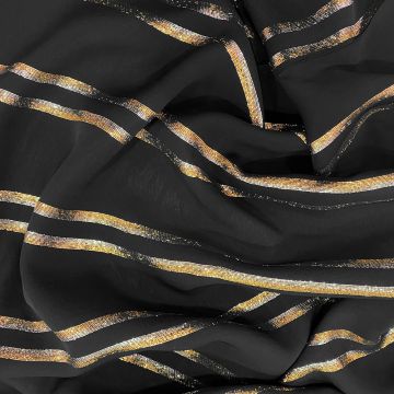 Metallic striped chiffon fabric on black background