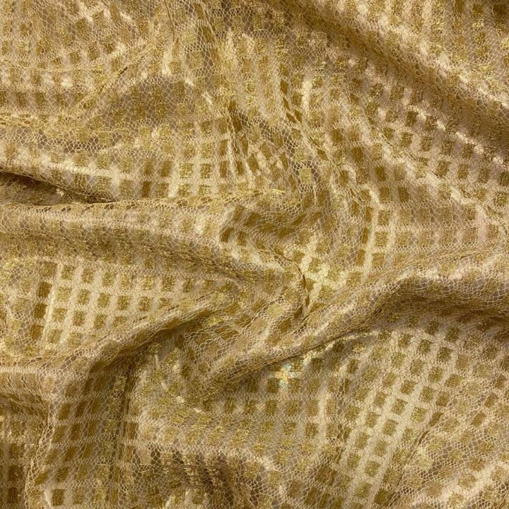 Gold square lace on a gold background fabric