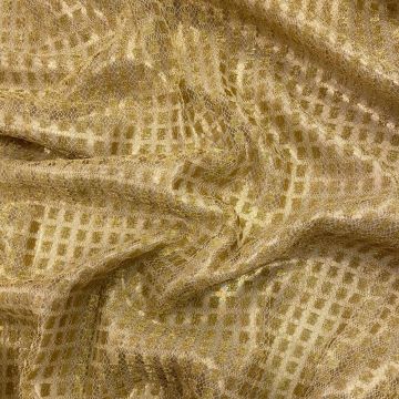 Gold square lace on a gold background fabric