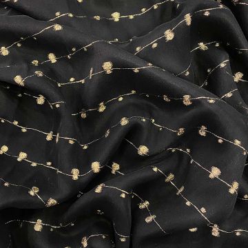 Jacquard silk fabric with cut gold bubbles on black voile