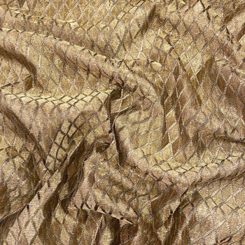 Tissu dentelle losanges or sur fond noir