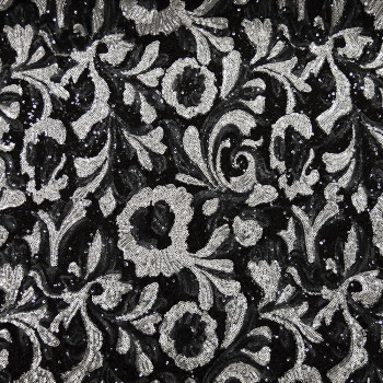 Silver sequins fabric on black background