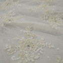 Tissu tulle brodé perlé ivoire (1,90 mètres) Tissu tulle brodé perlé ivoire (1,90 mètres)