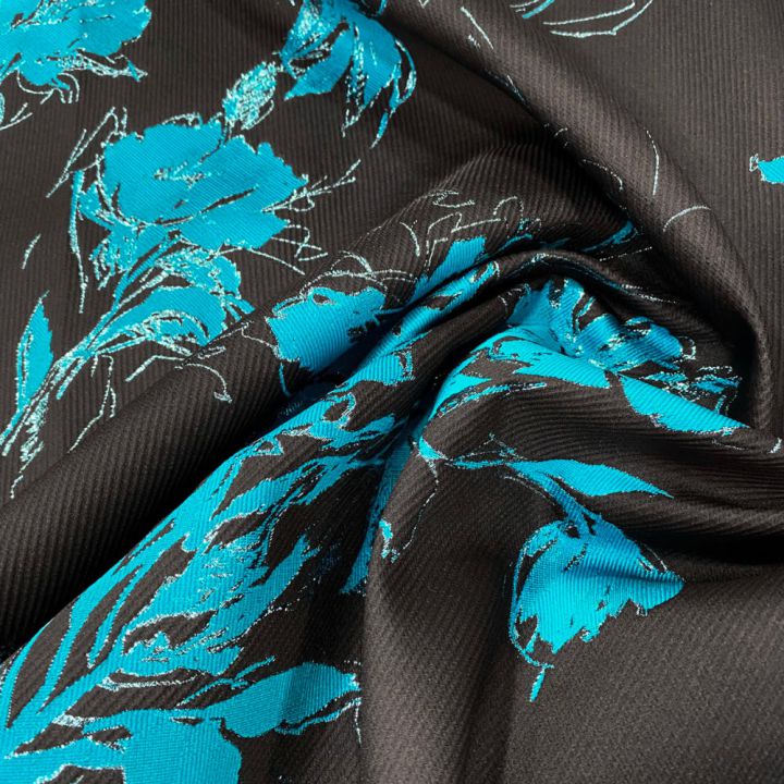 Turquoise floral fil coupé on black silk jacquard fabric