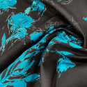Turquoise floral fil coupé on black silk jacquard fabric Turquoise floral fil coupé on black silk jacquard fabric