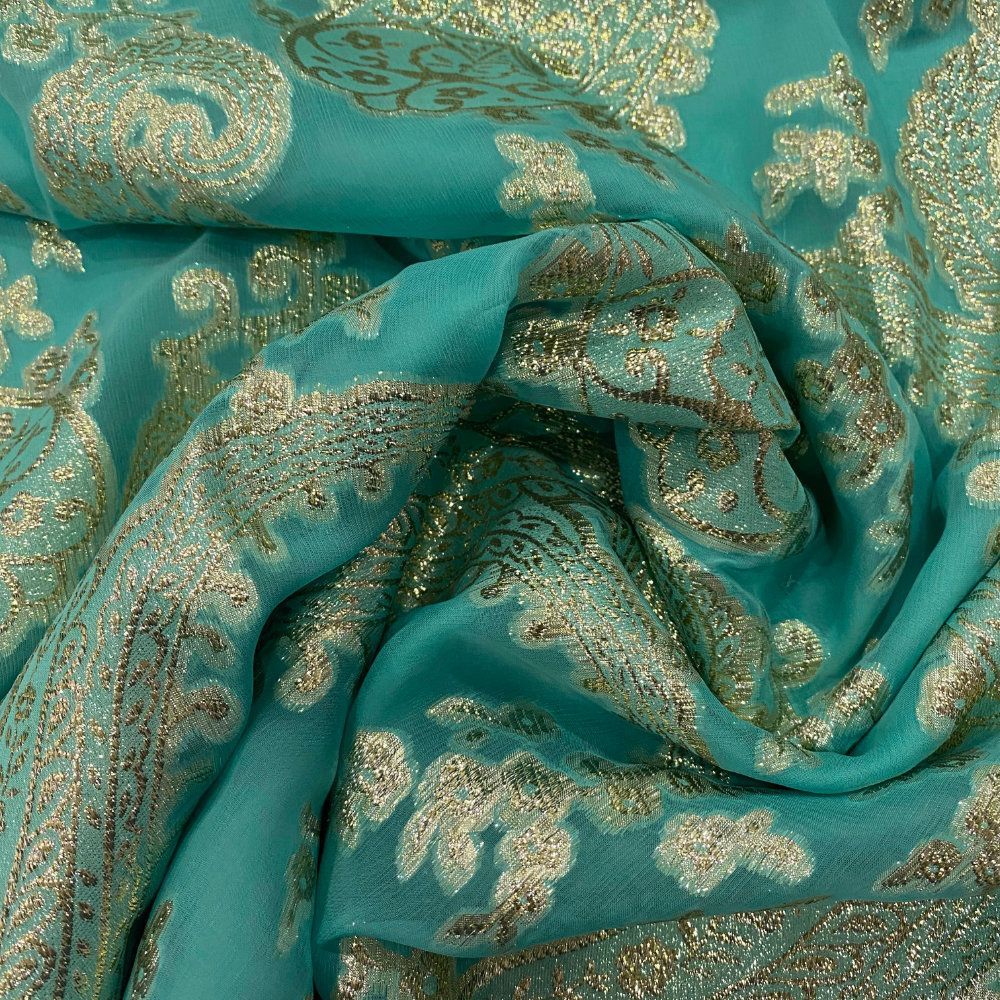 Jacquard de soie métal paisley or sur fond mousseline turquoise