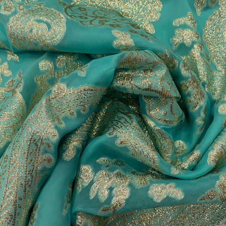 Gold paisley metallic silk jacquard on a turquoise chiffon background