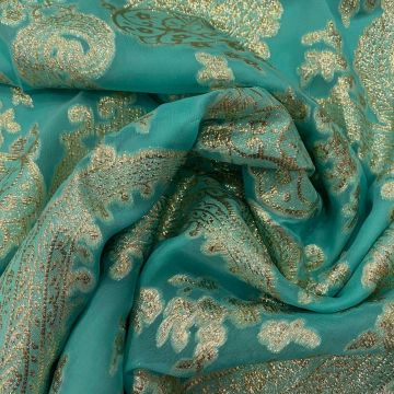 Jacquard de soie métal paisley or sur fond mousseline turquoise