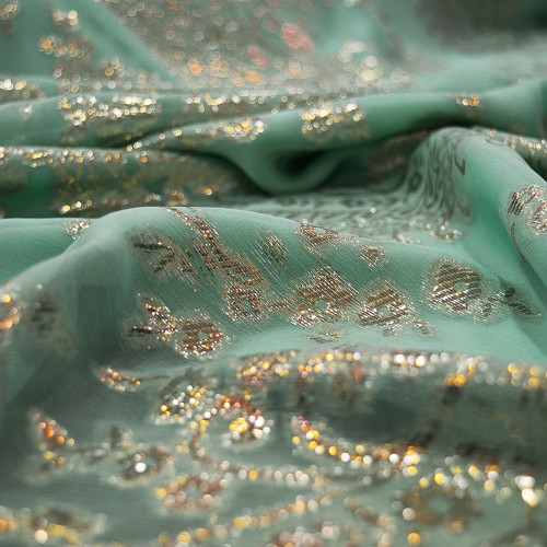 Gold metal silk jacquard fabric on jade green chiffon